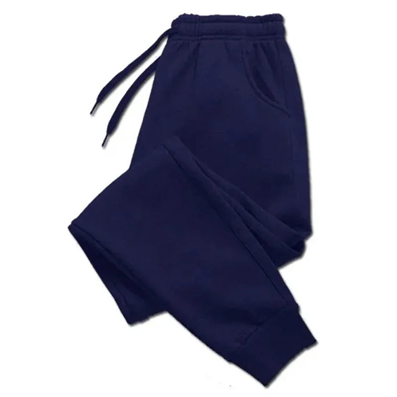 Navy blue fleece sweatpants with an elastic waistband and drawstring, designed for warmth and comfort. Perfect for autumn and winter casual wear.