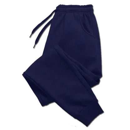 Navy blue fleece sweatpants with an elastic waistband and drawstring, designed for warmth and comfort. Perfect for autumn and winter casual wear.